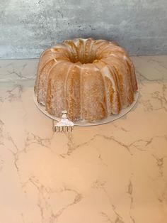 a bundt cake sitting on top of a marble counter