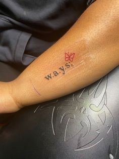 a person with a tattoo on their arm that says, yes yaw written in red ink