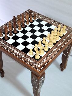 a chess board and pieces on a coffee table