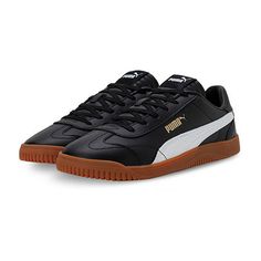 Inspired by terrace culture, the casual Sneaker Puma Club 5v5 is born on the pitch and connects our love for football with a modern court silhouette. The upper features a coated leather material combined with synthetic leather. The t-toe on the vamp as well as the stitching lines incorporate football dna but are reinterpreted in a modern way. The low-to-the ground rubber outsole comes along with a wavy outlook providing durability in style. The gold foil lateral puma branding adds to the premium Modern Skate Shoes With Rubber Waffle Outsoles For Sports, Sporty Puma Logo Skate Shoes For Sports, Sporty Puma Skate Shoes For Sports, Sporty Puma Skate Shoes, Modern Black Sneakers With Puma Logo, Modern Black Puma Sneakers, Black Puma Skate Shoes For Sports, Black Sporty Puma Logo Skate Shoes, Black Sporty Skate Shoes With Puma Logo