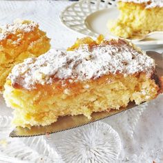 two pieces of cake sitting on top of a white doily next to a fork