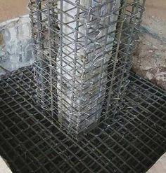 a large metal cage sitting on top of a cement floor