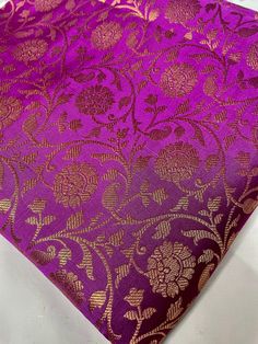 "This one yard listing is for a purple gold  Indian sari brocade fabric by the yard with a beautifully contrasting woven in a floral pattern. For a yard, you will get 36\" X 44\" or @ 90cm X 110cm. ABOUT BROCADES These brocades are machine woven.  A metallic thread that is golden/ bronze/ silver/ copper in color is cross woven in a pre-set pattern with the base thread usually of a bright color.  They are manufactured in Benares or Banaras, which is one of the biggest fabric hubs of North India a Purple And Gold African Fabric, Eggplant Indian, Wedding Ring Cushion, Purple Eggplant, North India, Cushion Ring, Set Patterns, Indian Sari, Clothes Dress