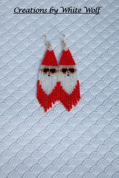 These earrings are made to celebrate the winter holidays...they feature Santa Claus wearing gold-rimmed sunglasses. They are hand-beaded using high quality glass beads. They are 3 1/2 inches in length (including the gold-filled ear wires) and about an inch wide. They would be a wonderful gift for any holiday fan or keep them for yourself to wear at your holiday parties! * Ready to Ship * Arrive in a Gift Box * Free Shipping in the USA for all orders of at least $35 Thank you so much for taking time to look at my beadwork! To see more, please visit my shop:  https://www.etsy.com/shop/creationsbywhitewolf Want to make your own? You can find the pattern at ETSY shop Beading Patterns for Fun. Beaded Christmas Earrings, Santa Earrings, Christmas Earrings, Bead Earrings, Hand Beading, Winter Holidays, Beading Patterns, Ear Wires, Holiday Parties