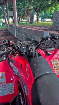 two red motorcycles parked next to each other