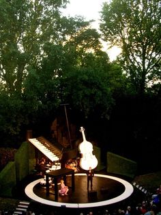 an overhead view of a concert stage with musical instruments and people sitting on the seats