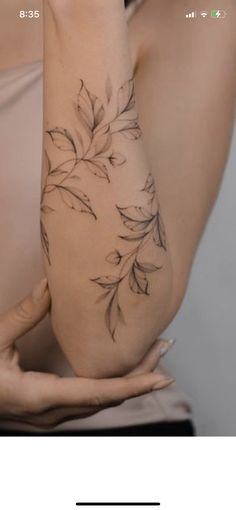 a woman's arm with flowers on it and the words, tattoo removal in black ink