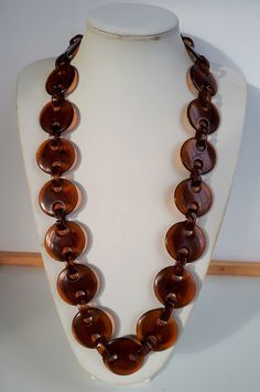 Chic RUNWAY vintage 80's swirl butterscotch plastic resin continuous necklace with big disk beads and chunky links - with smooth finish and no seems. Necklace inner length 30 inches; disks : 1-3/8 inches diameter; 1/8 inches width. Good condition. Similar items are listed.  To make this a smooth and pleasant transaction experience for everyone, all buyers need to read and understand the description, the terms of sale , the payment and the shipping indicated in this listing. Return not accepted - Chunky Jewelry Necklace Folksy, Handmade Retro Brown Necklaces, Vintage Chunky Gold Necklace, Vintage Gold Chunky Necklace, Brown Chunky Necklace, Runway Vintage, Wire Necklace, Plastic Resin, Resin Necklace