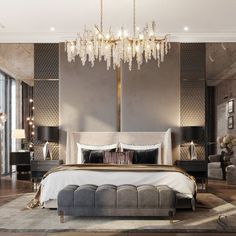 a bedroom with a large bed and chandelier