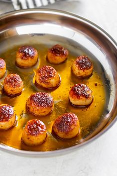 some food is cooking in a pan on the stove top and ready to be cooked