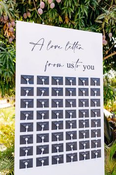 a sign that has been placed on the ground for someone to write their names and pictures