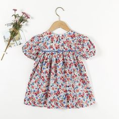 Toddler Girl Floral Print Puff Sleeve Dress - PrettyKid Playful Doll Collar Dresses For Spring, Playful Spring Dress With Doll Collar, Spring Dresses With Doll Collar Playful Style, Spring Dresses With Doll Collar In Playful Style, Puff Sleeve Playtime Dress For Spring, Cotton Puff Sleeve Playtime Dresses, Spring Playtime Puff Sleeve Dress, Spring Puff Sleeve Playtime Dress, Cotton Puff Sleeve Dresses For Playtime