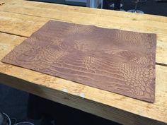 a wooden table with an alligator skin pattern on it