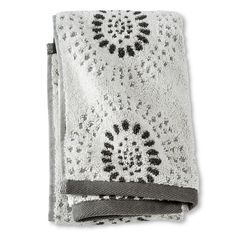 a white towel with black and grey designs on it