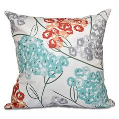 a white pillow with colorful flowers on it