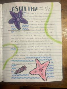 an open notebook with drawings of starsfishs and seahorses on the page