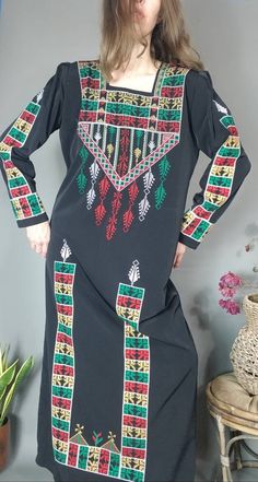 "Beautiful vintage bohemian dress with multicolor embroidery - great witchy hippie vibes. lovely lightweight comfortable dress circa 80s I believe No tags has shoulder pads, one button closure at the neck estimated fit s- xl depending on fit preference, body type etc Approximate measurements: armpit 22.5\" across hip 23.5-24\" shoulder,back seam to seam 16\" length 55\" shown unpinned on 5'8\" size s 32d-25-35 great preloved vintage condition, no notable flaws. Please message questions prior to Bohemian Vintage Dress, Bohemian Gown, Multicolor Embroidery, Dress Embroidery, Hippie Vibes, Caftan Dress, Embroidery Dress, Bohemian Dress, Vintage Bohemian