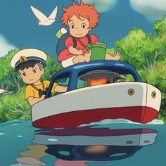 two people riding on top of a boat in the water