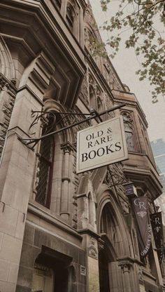 the old and rare books sign is attached to the building