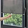 a person is pointing at the screen on a window