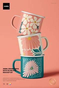 three coffee mugs stacked on top of each other with flowers painted on the cups