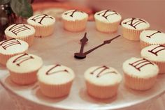 cupcakes are arranged in the shape of a clock