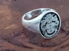 "Your custom solid sterling Silver ring will be made on your order, customize this Coat of Arms and your logo on this collection! A beautiful symbol that will fit your hands and style. perfect gift for anniversary, special dates and any date you can imagine can be Personalized. Different colors are silver, gold, rose gold. White gold and 24K gold options will never tarnish and last decades. Please contact me if you are interested in my jewelry. >ABOUT ME: I have 35 years of experience in making custom handmade silver and gold jewelry, including custom engraved Signet rings My childhood kind of allowed me to live among precious metals and gems pretty much I opened my workshop back in 1986 Never got bored of making Personalized gifts, birth flower rings, engagement rings with real diamonds F Classic Oval Engraved Ring Customizable, Custom Sterling Silver Engraved Ring, Customizable Silver Engraved Ring, Classic Personalized Engraved Ring For Commemoration, Custom Silver Engraved Ring, Classic Oval Customizable Signet Ring, Custom Silver Engraved Ring With Polished Finish, Custom Engraved Silver Ring, Sterling Silver Engraved Ring For Commemoration