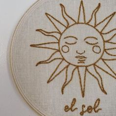 a cross stitch sun with the words el sol on it