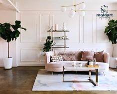 a living room filled with furniture and potted plants