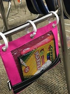 a pink bag hanging from a chair with the words keep student supplies handy on it