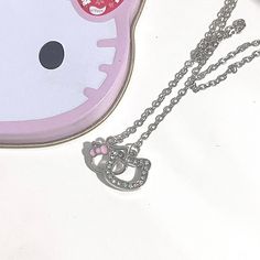 Description:Dainty CZ Inlaid Kitty Pendant NecklaceSpecifications:Material: cubic zirconia. copper. enamel. 18k white goldColors: silverSize: 40 cm + 5 cm extWeight: 4.3 g/pcsFeatures & Details:Material: This dainty crystal kitty pendant necklace is made of environmental friendly materials. which is solid. durable. lightweight and very comfortable and healthy for daily wear. Stylish design: The shiny. durable and comfortable crystal kitty necklace shows the smooth surface of the jewelry that is laying flat on you for an elegant look. Ocassions: It is easy to match your different outfits and also suitable for any occasions like wedding. banquet. costume party. engaged party. prom. anniversary. holiday. evening party or other social events. where let you look elegant. attractive and fashiona Cute Silver Clavicle Chain Jewelry, Cute Silver Charm Necklaces With Clavicle Chain, Cute Round Silver Necklace, Silver Enamel Jewelry With Adjustable Chain, Cute Silver Metal Necklace, Silver Enamel Pendant Charm Necklaces, Kitty Necklace, Wedding Banquet, Cat Pendants