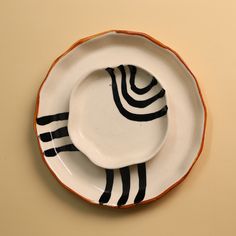 a white plate with black stripes on it