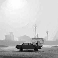 black and white photograph of a man standing next to a car