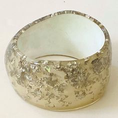 Rare Vintage Mid Century (Circa 1960's) Lucite Plastic Bracelet With Clear And Silver Foil Pieces Inside. Approx. 1 1/4" To 1 5/8" Wide Across Slimmest And Widest Points Of Inside Of Bracelet. Fits Very Small!!! Standard 2 1/2" Wrist Opening Across Top, But Because It Is So Wide You Will Need To Have Very Small Hands To Fit Into It. My Hand Measures About 4" Across It's Widest Points From Bottom Of Pinky To Index Finger And I Cannot Fit My Hand Into The Bracelet. May Just Be Good For Display Because It Is So Small. Expect Signs Of Age And Previous Wear. Silver Confetti, Index Finger, Wide Bracelet, Silver Foil, Small Hands, Womens Jewelry Bracelets, Confetti, Vintage Jewelry, Foil