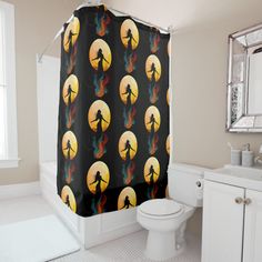 a bathroom with a shower curtain that has an image of a person holding a tennis racket