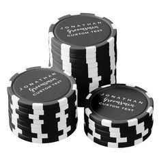 three stacks of black and white poker chips with the words lucky, feather on them