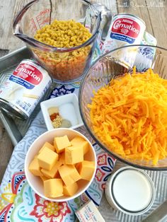 cheese, crackers, and other ingredients are on the table for making cheesy casserole