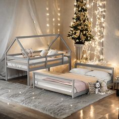 a bedroom decorated for christmas with lights on the wall and bed in the foreground