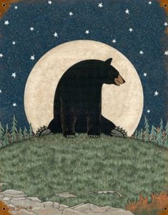 a black bear sitting on top of a grass covered hill under a moon filled sky