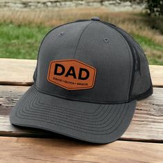 This Personalized Dad Patch Hat makes the perfect gift for him. With custom engraving of his kids' names, it's a unique and thoughtful present for Father's Day. Show your appreciation and make him feel special with this personalized trucker hat. PRODUCT INFORMATION: - Richardson 112 Trucker Hat or Yupoong 6606 - Size: Unisex - 6-panel construction delivers classic trucker style - Adjustable snapback for a custom fit - A cotton sweatband provides all-day comfort - High quality square leather patc Cheap Adjustable Trucker Hat For Father's Day, Make Him Feel Special, Father Presents, Patch Hat, Kids Names, Perfect Gift For Him, Feel Special, Leather Patches, Hat Making