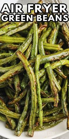 air fryer green beans on a white plate with the words, air fryer green beans