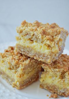 three pieces of cake on a plate with crumbs and nuts in the middle