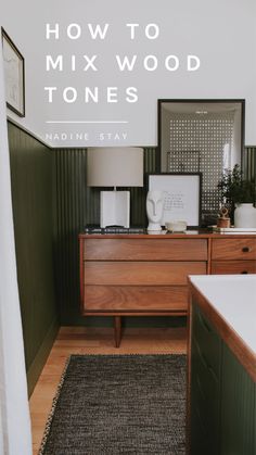 a wooden dresser sitting on top of a hard wood floor next to a white wall