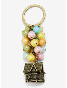 a house keychain with multicolored balloons hanging from it's front