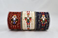 three rolls of ribbon with nutcrackers on them