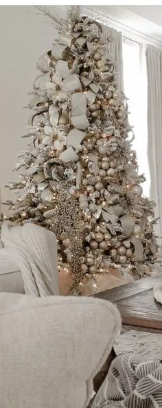 a white christmas tree in a living room