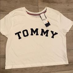 Tommy Cropped Tshirt Tommy Hilfiger Graphic Tee For Summer, Tommy Hilfiger Graphic Tee For Streetwear, Tommy Hilfiger Summer Graphic Tee, Casual Tan Tops With Text Print, Casual Tan Top With Text Print, Tommy Hilfiger Graphic Tee With Graphic Print, Trendy Tommy Hilfiger Cotton T-shirt, Tommy Hilfiger Graphic Print Tee, Sporty Tommy Hilfiger Tops With Graphic Print