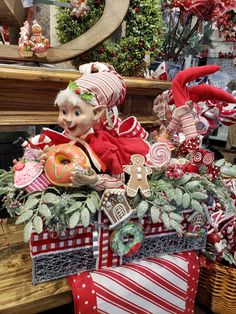 an assortment of christmas decorations on display in a store