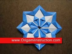 an origami star is shown in blue and white with the words organic instruction com