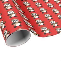 a red wrapping paper with pandas and skulls on it's face, in the style